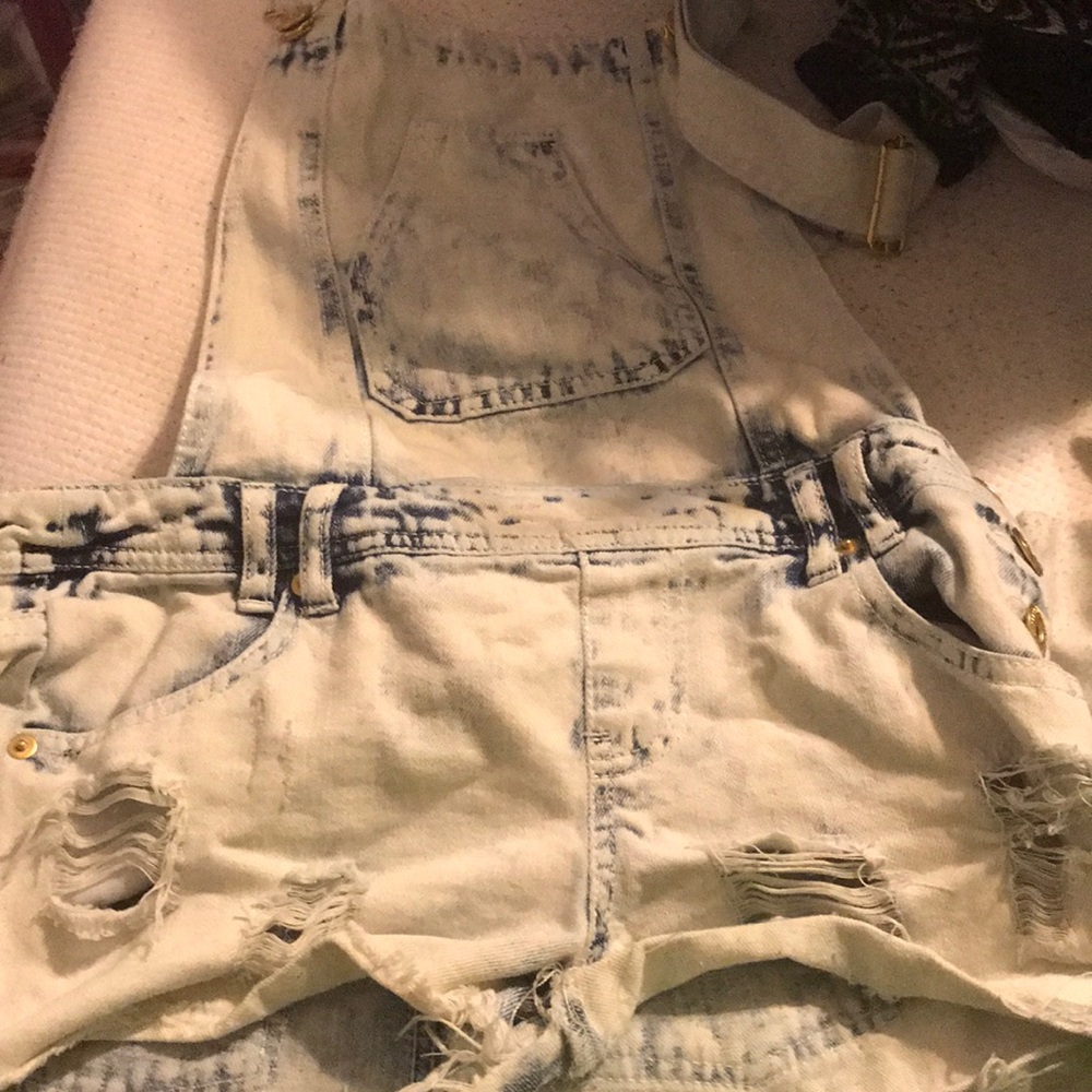 Light wash ripped jean overalls